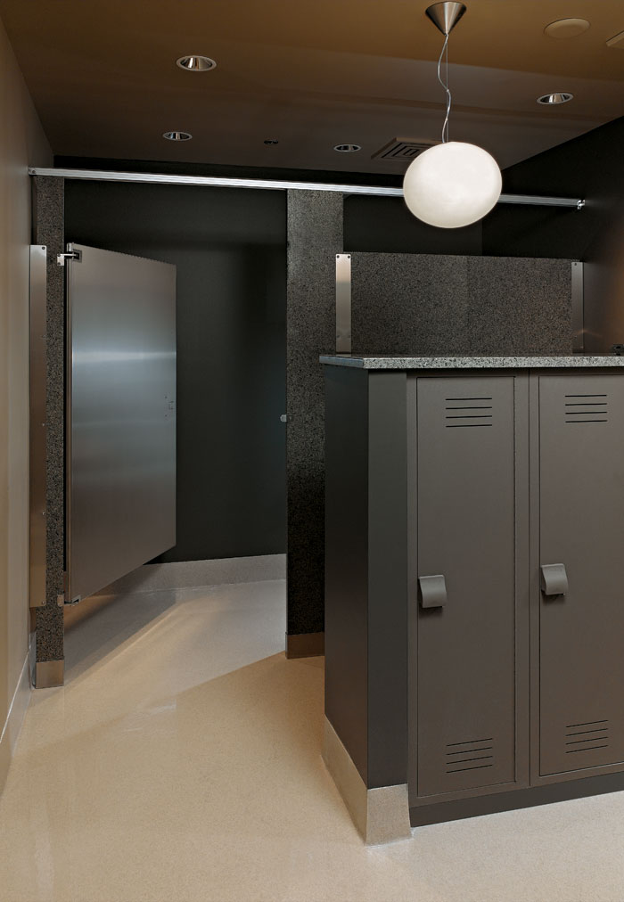 high end fitness center restroom with granite partitions and plastic lockers