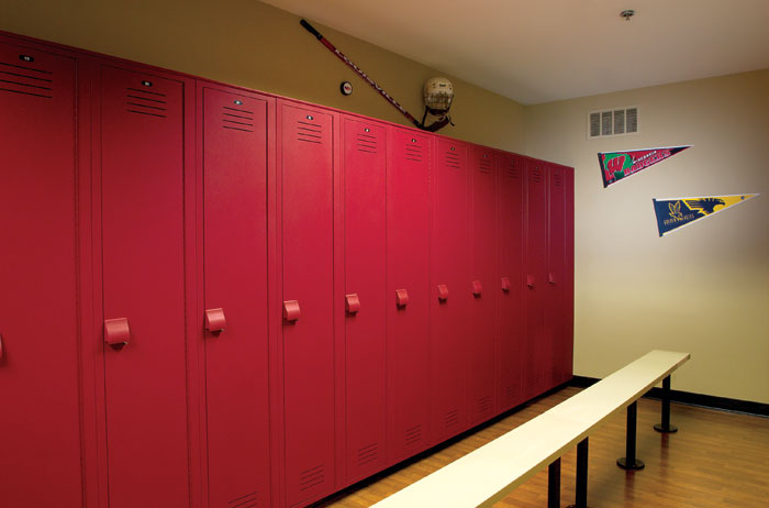 sports locker room featuring red plastic lockers