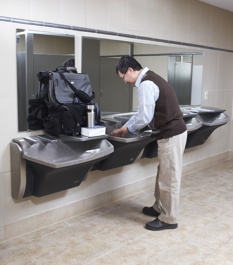 Retail restroom featuring the 3-in-1 Advocate AV-Series lavatory system that combines soap water and hand drying into one fixture