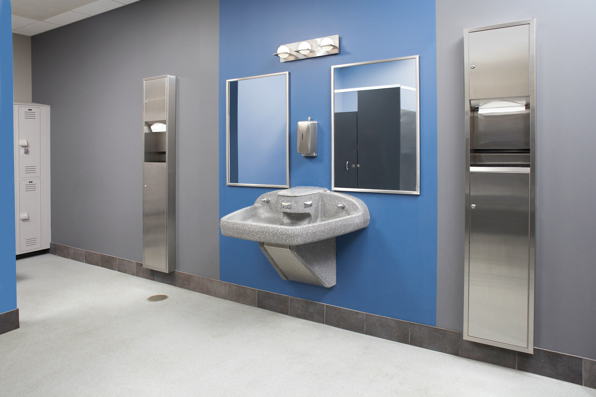 blue and grey restroom with multi-fount washfountain