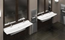 Dark and light restroom featuring two 2-station Verge L-Series lavatory systems made with Evero natural quartz surface