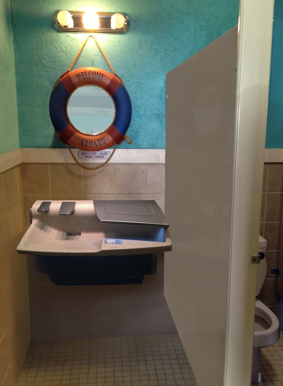 3-in-1 Advocate AV-series sink with co-located soap water and hand drying in a beach themed restaurant