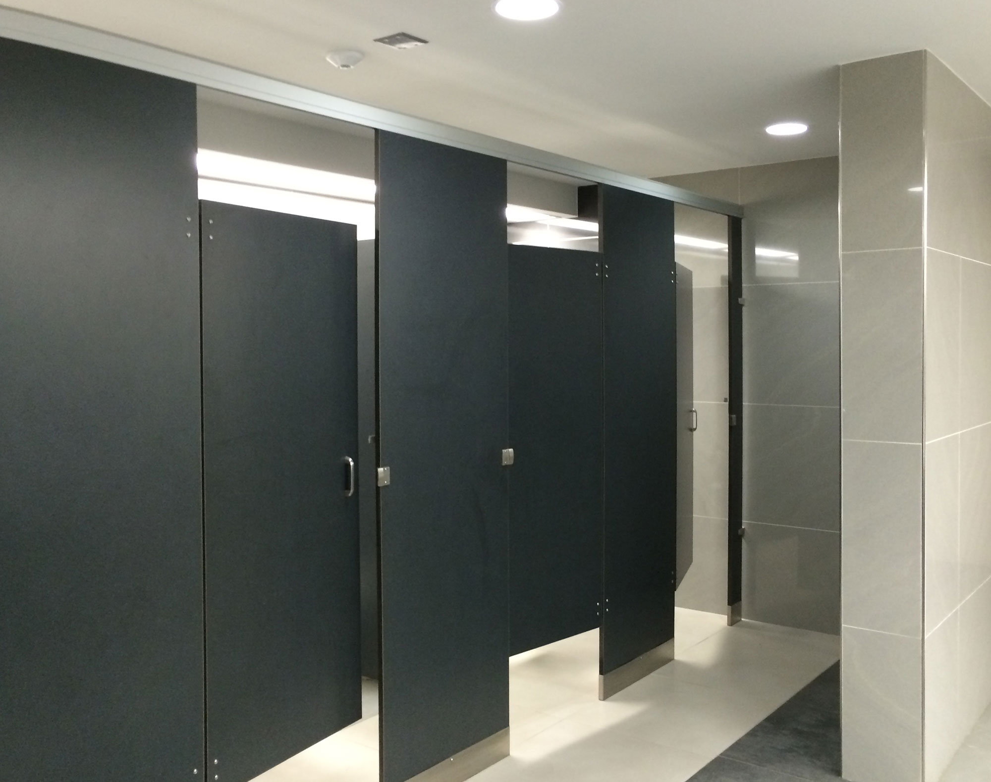 Airport bathroom with plastic laminate partitions