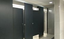 Airport bathroom with plastic laminate partitions